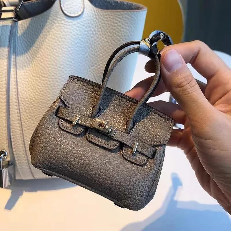 Mini-Anhänger für kleine Taschen, Kopfhörer-Paket, Auto-Schlüsselanhänger, kreativer Anhänger für Geldbörse mit allen passenden roten Umschlägen 9x10cm khaki