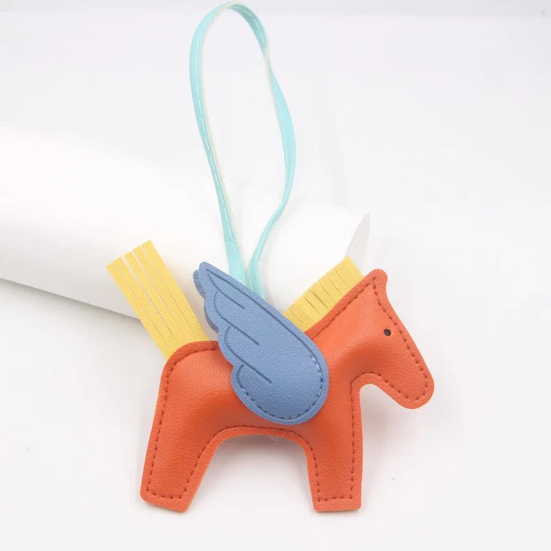 Hot Classic Wing Pony Bag Anhänger Dekorative Accessoires Auto Schlüsselanhänger Anhänger Hochwertige Lederproduktion Tassel winged horse orange/blau