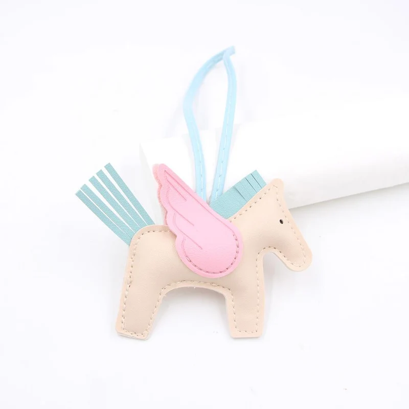 Hot Classic Wing Pony Bag Anhänger Dekorative Accessoires Auto Schlüsselanhänger Anhänger Hochwertige Lederproduktion Tassel winged horse blau/beige
